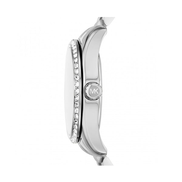 Side view of stainless steel MICHAEL KORS Mod. LEXINGTON wristwatch showing crystal details and MK logo on crown.