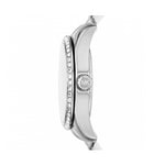 Side view of stainless steel MICHAEL KORS Mod. LEXINGTON wristwatch showing crystal details and MK logo on crown.