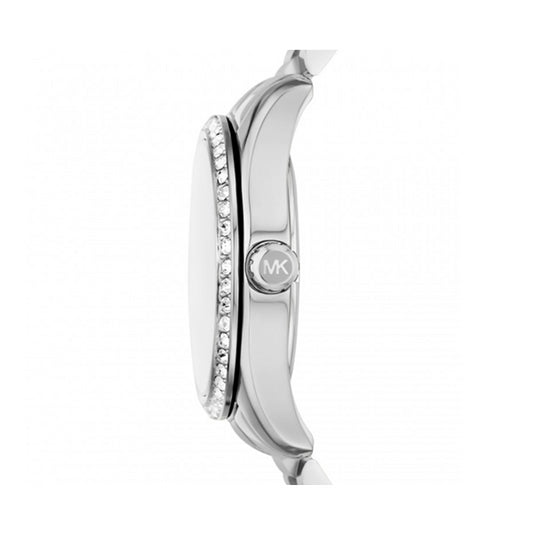 Side view of stainless steel MICHAEL KORS Mod. LEXINGTON wristwatch showing crystal details and MK logo on crown.