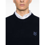 Maison Kitsuné MAISON KITSUNE' Sweaters Blue featuring oxford blue fisherman's knit, logo patch, and ribbed crew neck design.