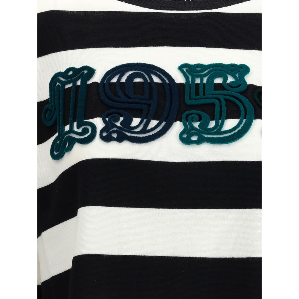 Close-up of Max Mara Black Fleece Wool Sweatshirt with '1951' embroidery on brown and white stripes.