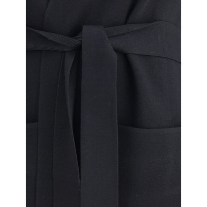 Close-up of Max Mara Black Viscose Coat highlighting the knotted removable sash and welt patch pockets for a refined touch.