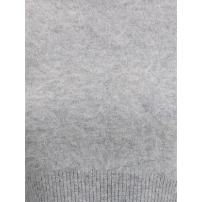 Close-up of Max Mara Gray Cashmere Cashmere Sweater highlighting its texture and ribbed hem, perfect for timeless elegance in AW25.