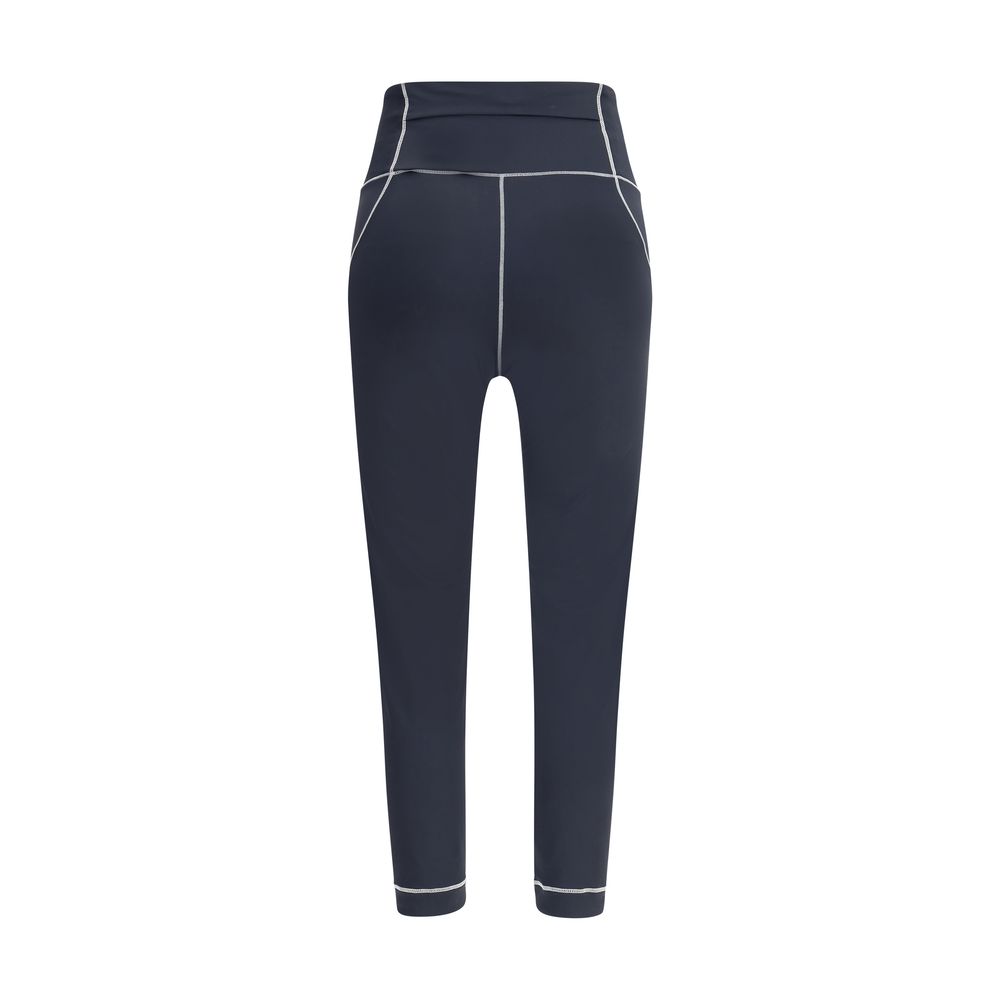 Back view of Moncler Grenoble Leggings in technical fabric with logo patches, designed for active lifestyle, slim fit, SS25 collection.