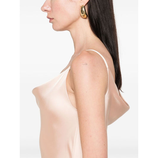 Side view of sand beige Norma Kamali Dresses Powder Maria slip gown with cowl neck and fishtail train.