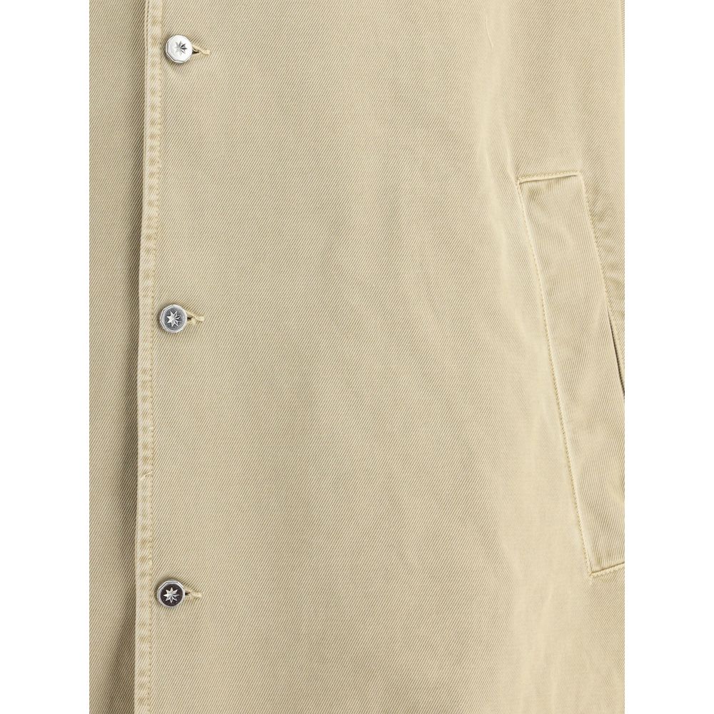 PDF Channel Oversized cotton Jacket detail showing front button closure and side welt pocket in beige fabric.