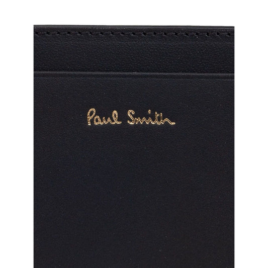Paul Smith Signature Stripe leather card case with black card slots and logo stamp on the front.
