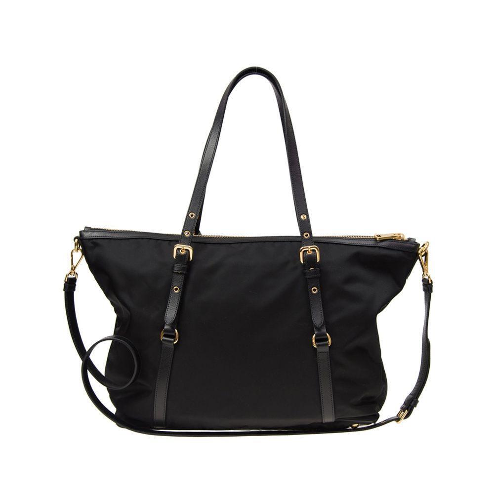 Front view with bag zipped and handles upright.