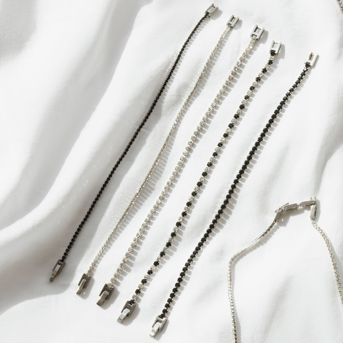 Assorted bracelets showcasing RADIANT JEWELS JEWELRY Mod. RH000011 on a white background, highlighting elegance and style.