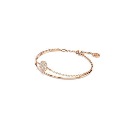 Rose gold SWAROVSKI Mod. 5683452 bangle bracelet featuring a celestial design with a chain and domed ornament from the Meteora collection.