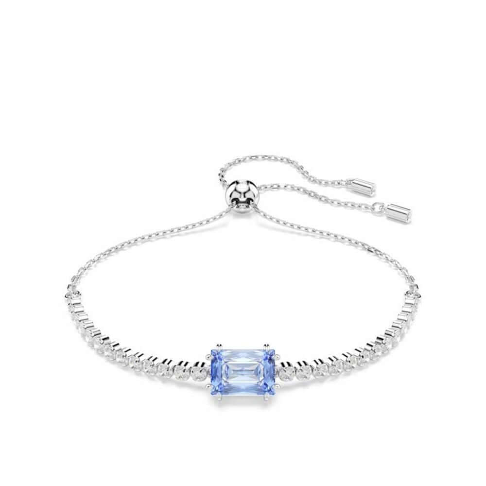 Elegant silver bracelet with blue gemstone centerpiece on white background
