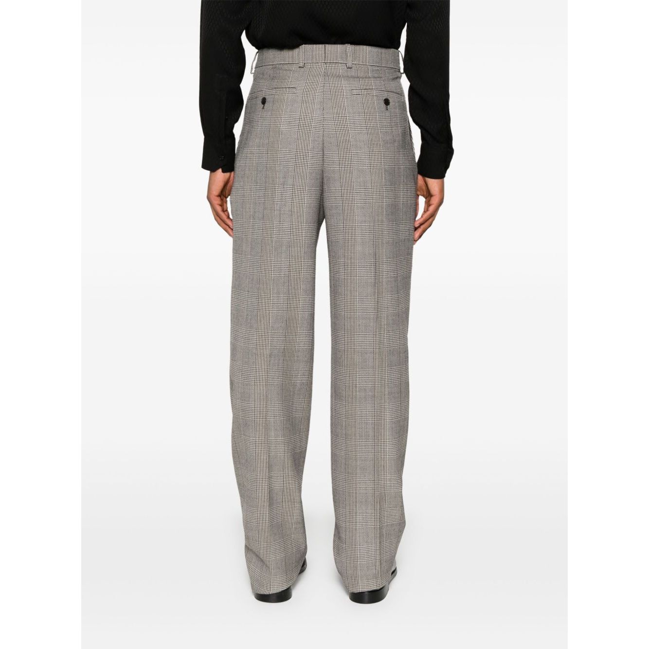 Back view of light brown Saint Laurent trousers with concealed front, hook and zip fastening, inset and jetted pockets, and belt loops.