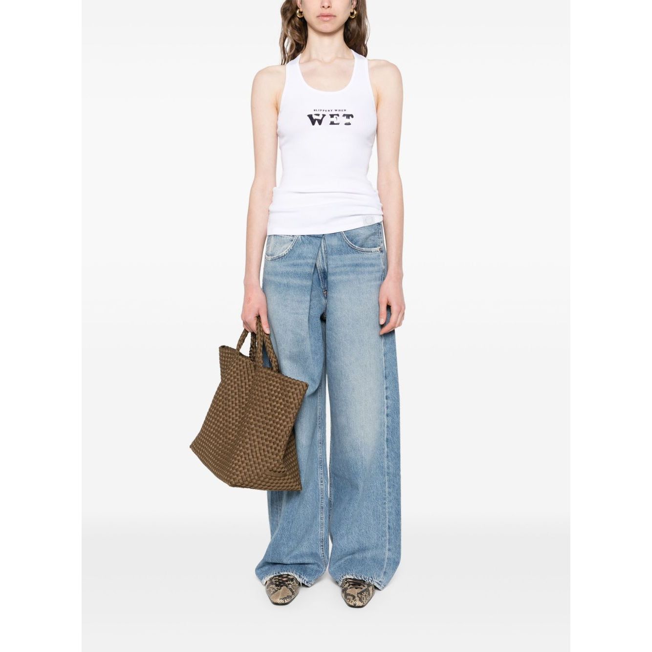 Stella McCartney Top White racerback scoop neck sleeveless Slippery When Wet tank top shown with model holding brown woven bag.