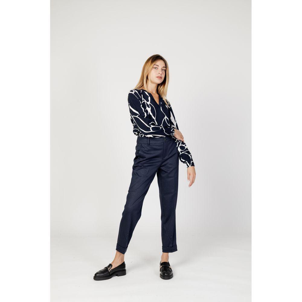 Model wearing Street One Blue Viscose Pant, stylish high-waist trousers, featuring a modern fit and double button fastening for a chic look.