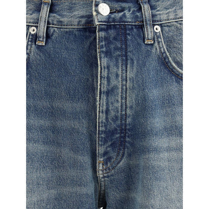 Close-up of Sunflower Blue Cotton Jeans Denim with vintage wash and recycled metal trim, showcasing twisted wide denim detail.