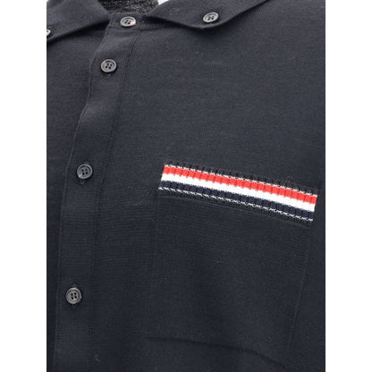 Thom Browne Black Fleece Wool Sweatshirt with tricolor detail on front pocket, showcasing a refined design with button closure and ribbed collar.