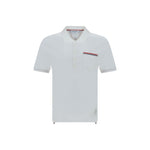 Thom Browne Short Sleeves Polo Shirt with classic collar, patch pocket, and iconic contrasting bands.