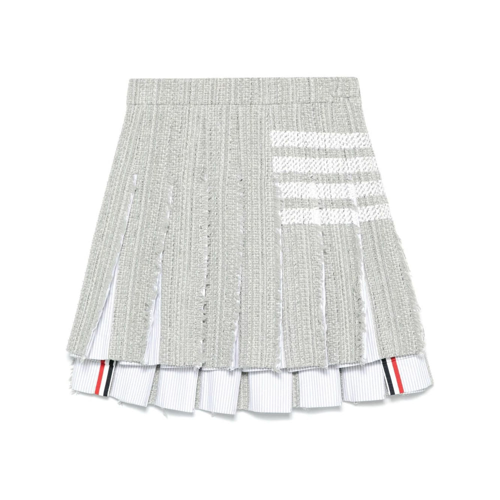 Thom Browne Skirts Grey featuring medium grey frayed edge, side button, zip fastening, signature 4-Bar tab, and 4-Bar stripe design.