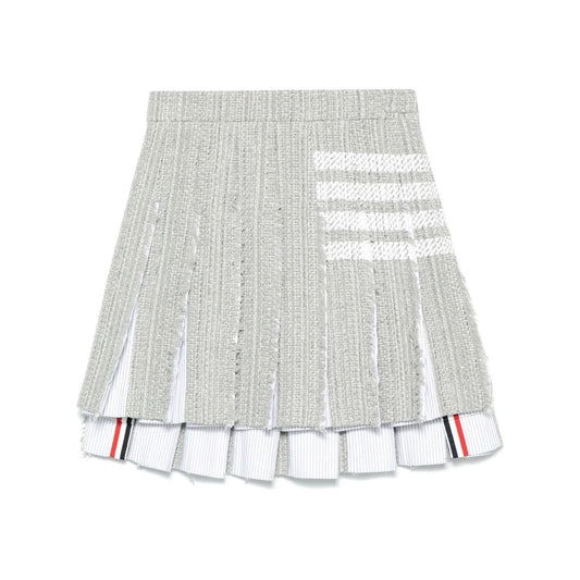 Thom Browne Skirts Grey featuring medium grey frayed edge, side button, zip fastening, signature 4-Bar tab, and 4-Bar stripe design.