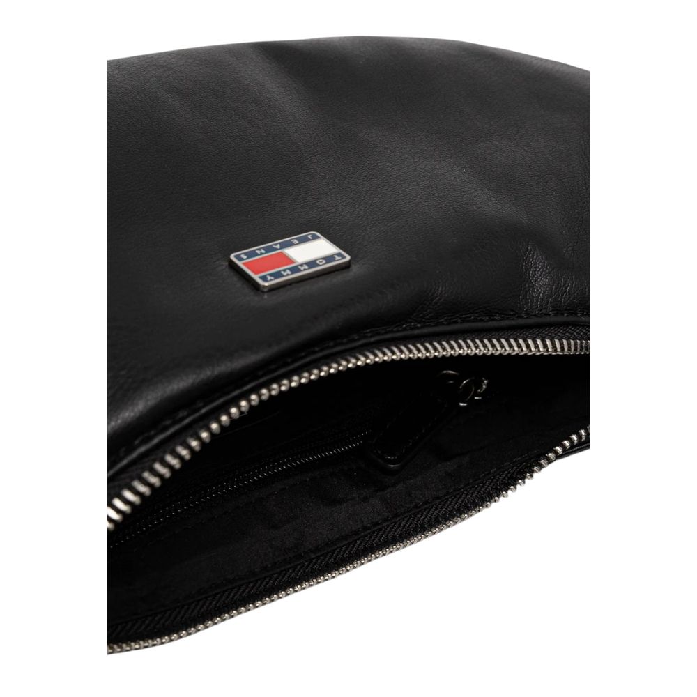 Close-up of a Tommy Hilfiger Black Polyethylene Handbag with zip closure and logo detail.