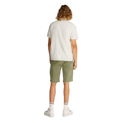 Back view of Tommy Hilfiger Jeans Cream Cotton Shortsleeve Shirt on model, highlighting casual style and comfort.