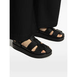Tory Burch Sandals Black with multiple strap design, logo detail, cushioned sole, open toe and flat base. Leather Kira Fisherman Sport.