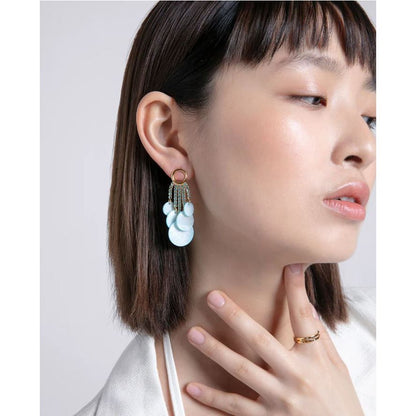 Woman wearing VICEROY JEWELS Mod. 13192E100-93 silver earrings with quartz movement, 10 ATM water resistance, multifunction features.