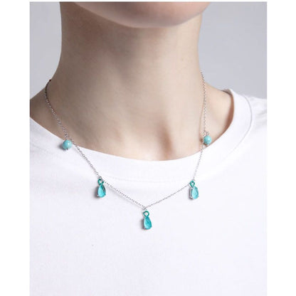 Lady wearing VICEROY JEWELS Mod. 13197C000-93 silver necklace with turquoise stones, suitable for everyday elegance, water resistant 10 ATM.