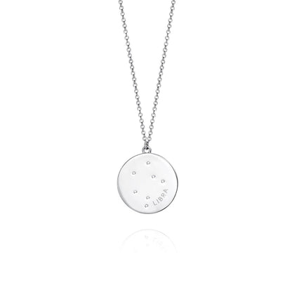 Silver necklace with round pendant featuring star constellation design for Libra.