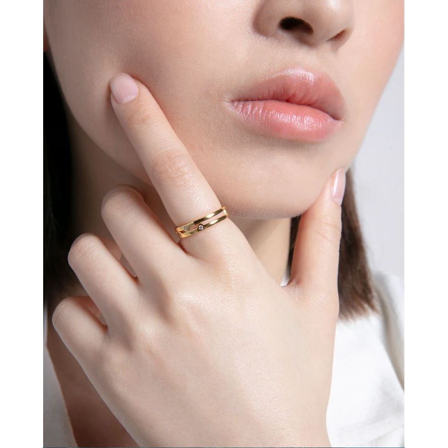 Fashion model wearing an elegant gold double band ring showcasing a minimalist style accessory
