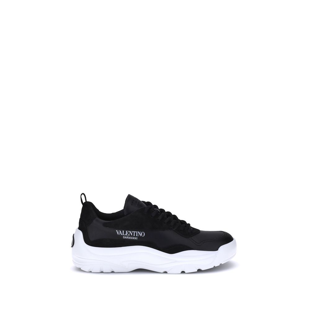Valentino Garavani Black Calf Leather Bos Taurus Chunky Sneakers with logo and suede details, side view.