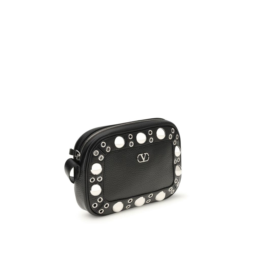 Valentino Garavani Black Leather Shoulder Bag with palladium-finish details, ball studs, adjustable strap, and VLogo Signature metal detail.