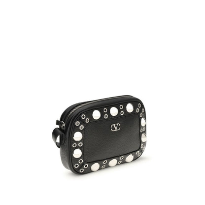 Valentino Garavani Black Leather Shoulder Bag with palladium-finish details, ball studs, adjustable strap, and VLogo Signature metal detail.