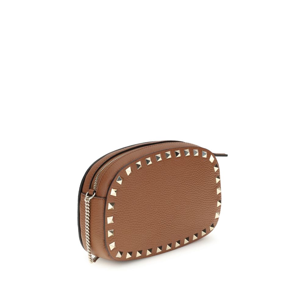 Valentino Garavani Brown Calf Leather Bos Taurus Shoulder Bag with platinum-finish studs, top zipper, and adjustable chain.
