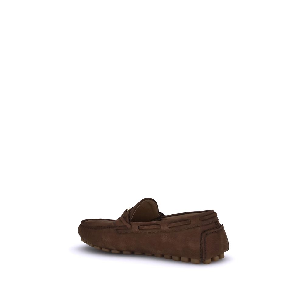 Valentino Garavani Brown Rubber Slip-On Loafers with suede finish and VLogo plaque, side view showing notched rubber sole.