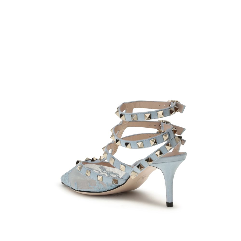 Valentino Garavani Light Blue Fabric High Heel Pumps with platinum-finish studs and suede straps, side view.