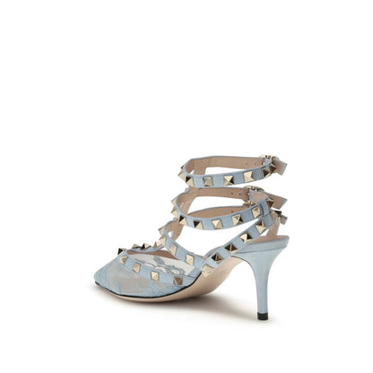 Valentino Garavani Light Blue Fabric High Heel Pumps with platinum-finish studs and suede straps, side view.