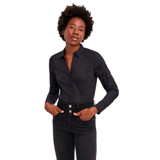 Woman wearing Vero Moda Black Cotton Bodysuit with long sleeves, showcasing a versatile and elegant design.