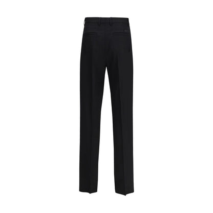 Back view of Versace Black Fleece Wool Dress Pants showcasing slim fit and tonal jacquard label.