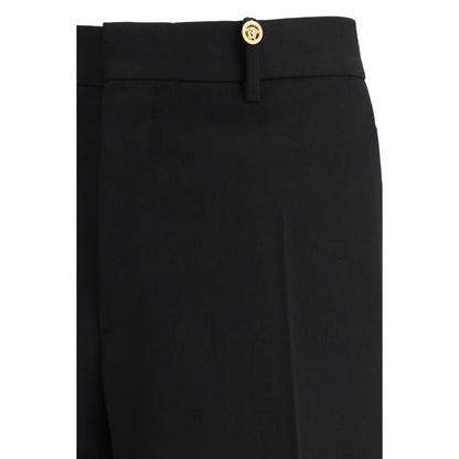 Versace Black Fleece Wool Dress Pants with slim fit and jacquard label detail, featuring concealed hook-and-zip closure.