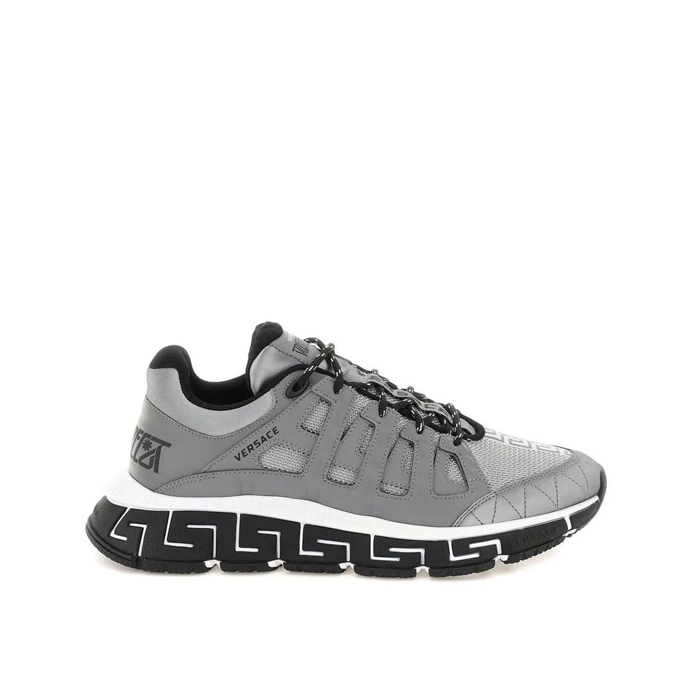 Versace Trigreca Sneaker with leather details, rubber sole, and front and back logo detail, made in Italy.