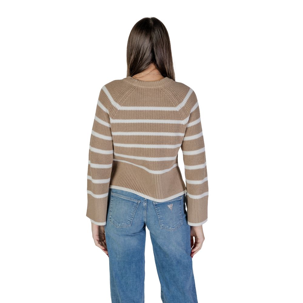 Back view of a woman wearing a Vila Clothes Beige Cotton Sweatshirt with stripes and long sleeves, styled with blue jeans