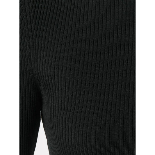 Close-up of ribbed knit fabric on Wolford Sweaters Black, showcasing the fitted silhouette and roll neck design.