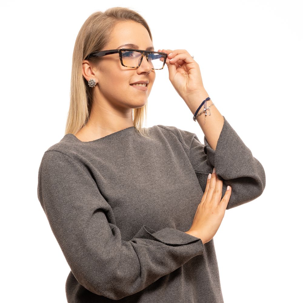 Woman wearing Yohji Yamamoto Brown Women Glasses Frame, full-rim rectangle style, with plastic brown frames, demo lenses.