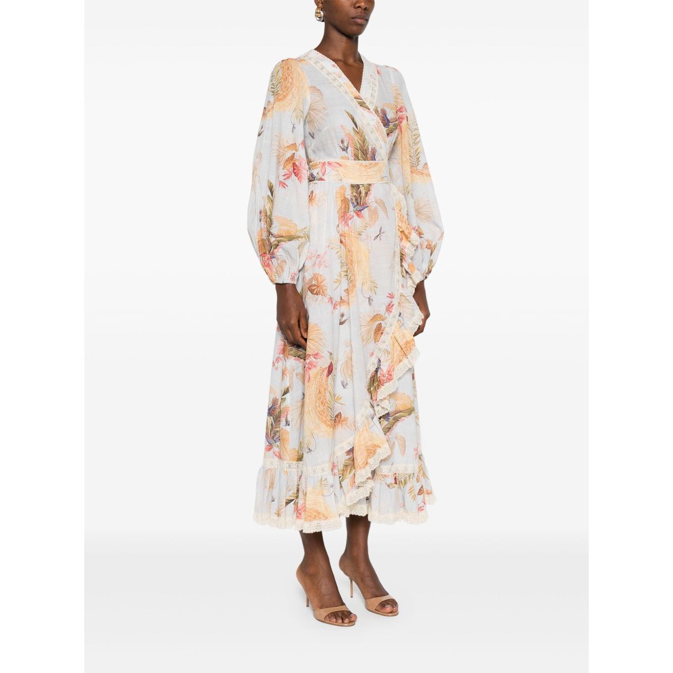 Zimmermann Ascension Ruffled Midi Dress in light blue with floral print and lace trim, wrap design, worn by model, side view.