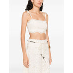 Zimmermann Cropped top with beige tie-fastening straps, cut-out floral detailing, and embroidered bodice, featuring a lettuce hem.